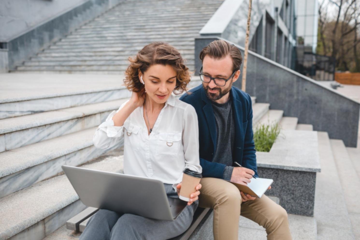 Business financial planning session with charts and documents on desk